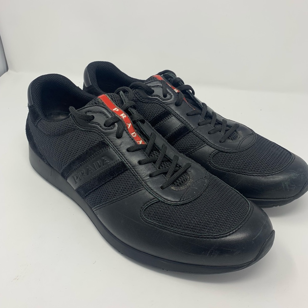 Prada men’s black leather tennis shoe.